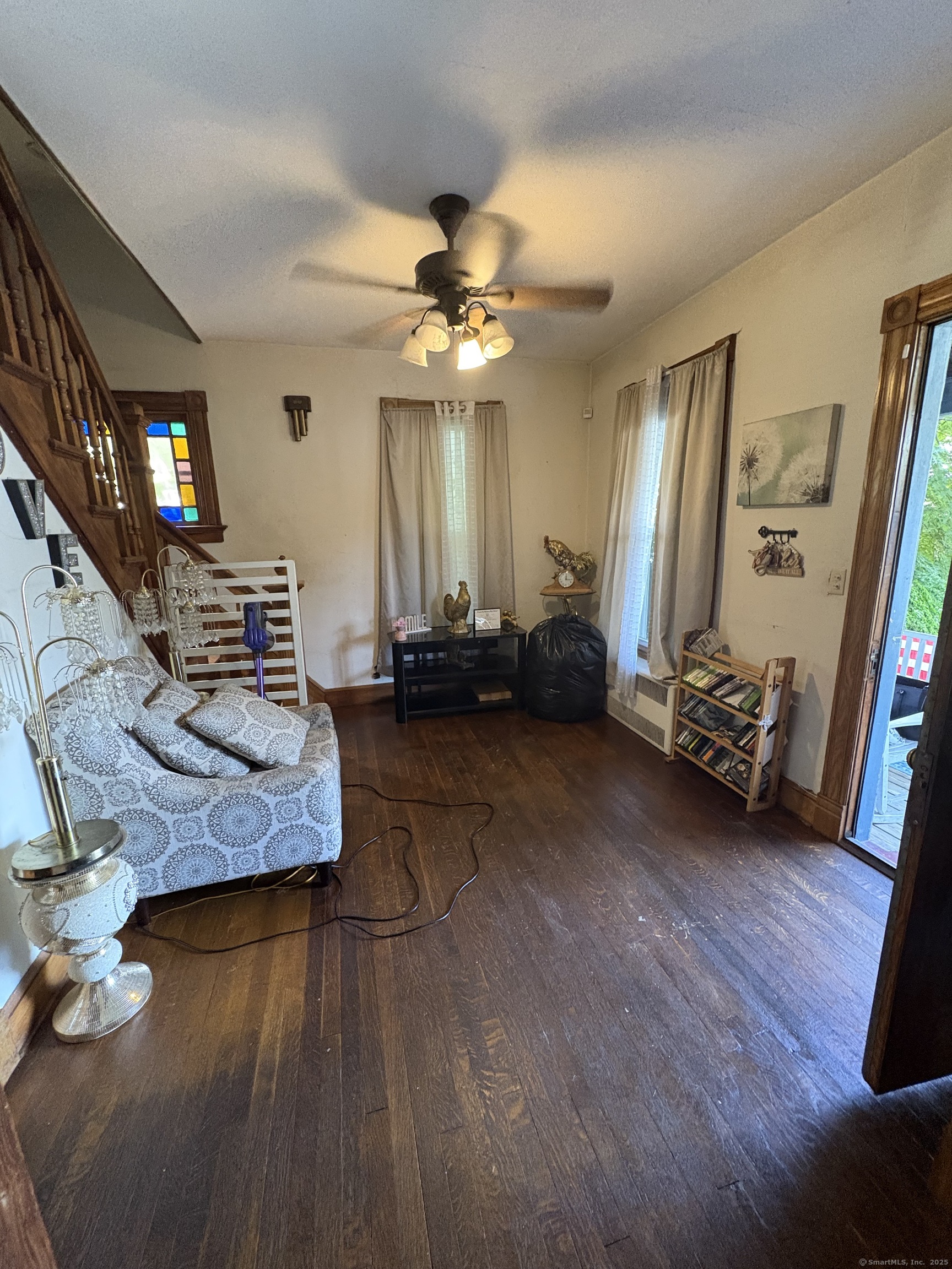 178 Elm Street Meriden, CT 06450 - Photo 17 of 18 a living room with furniture and a flat screen tv
