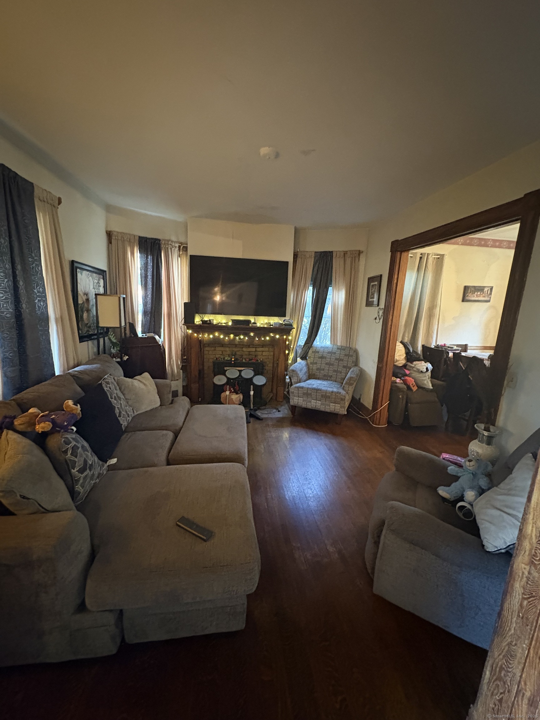 178 Elm Street Meriden, CT 06450 - Photo 18 of 18 a living room with furniture and a flat screen tv