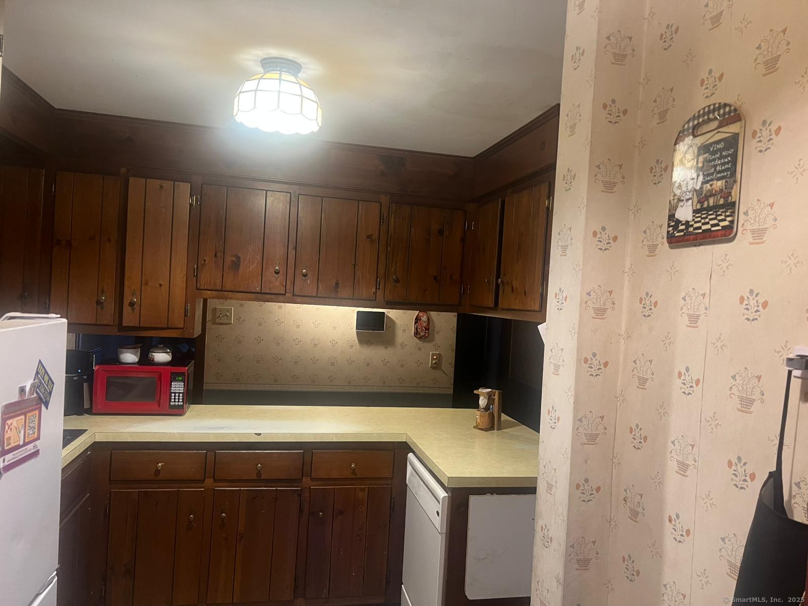 178 Elm Street Meriden, CT 06450 - Photo 10 of 18 a utility room with cabinets washer and dryer