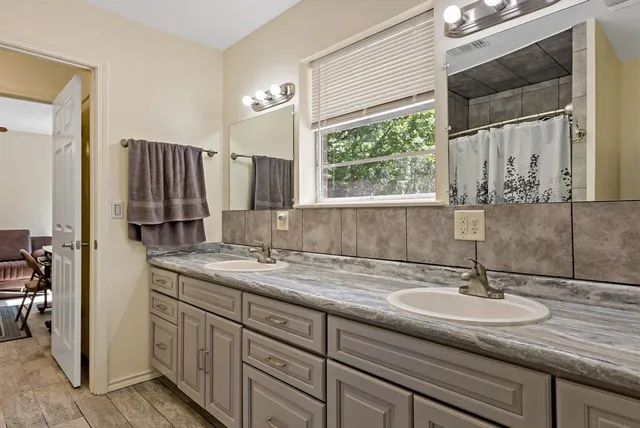 a kitchen with a sink and a window