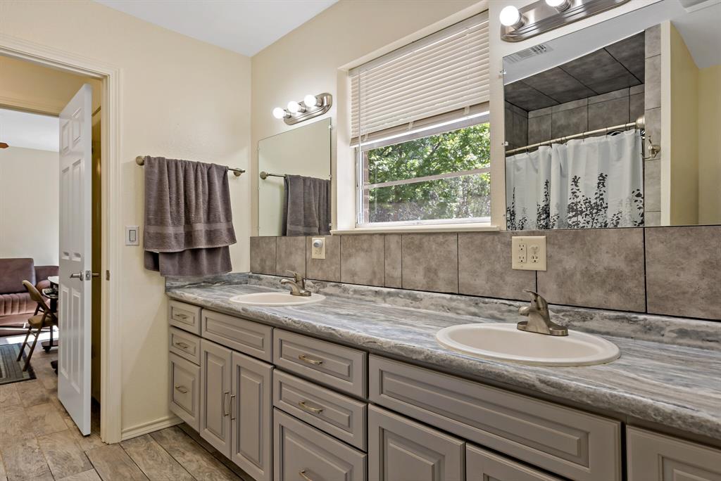 150 County Road Arthur City, TX 75411 - Photo 21 of 37 a kitchen with a sink and a window