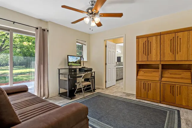 a bedroom with furniture and a window