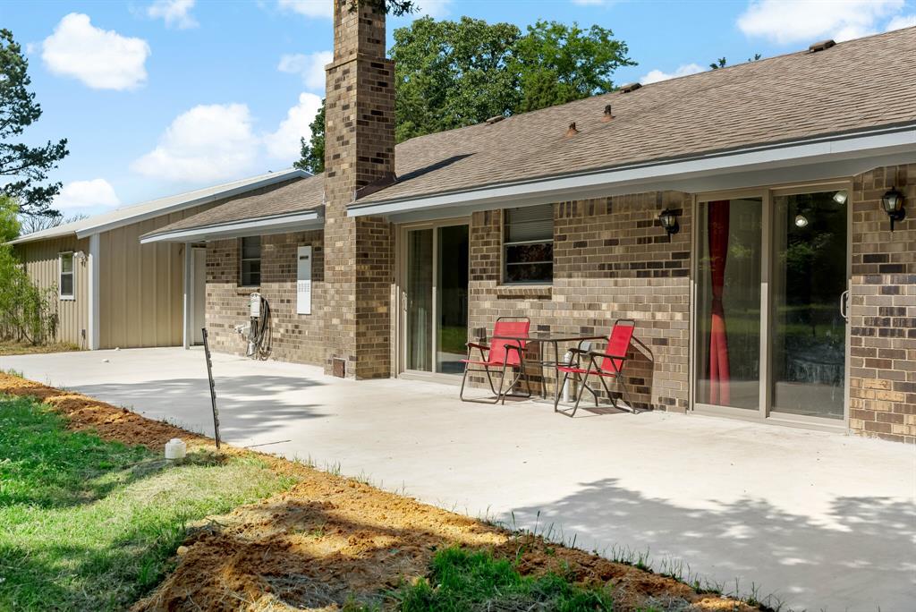 150 County Road Arthur City, TX 75411 - Photo 27 of 37 a view of a chair with a small yard in front of it