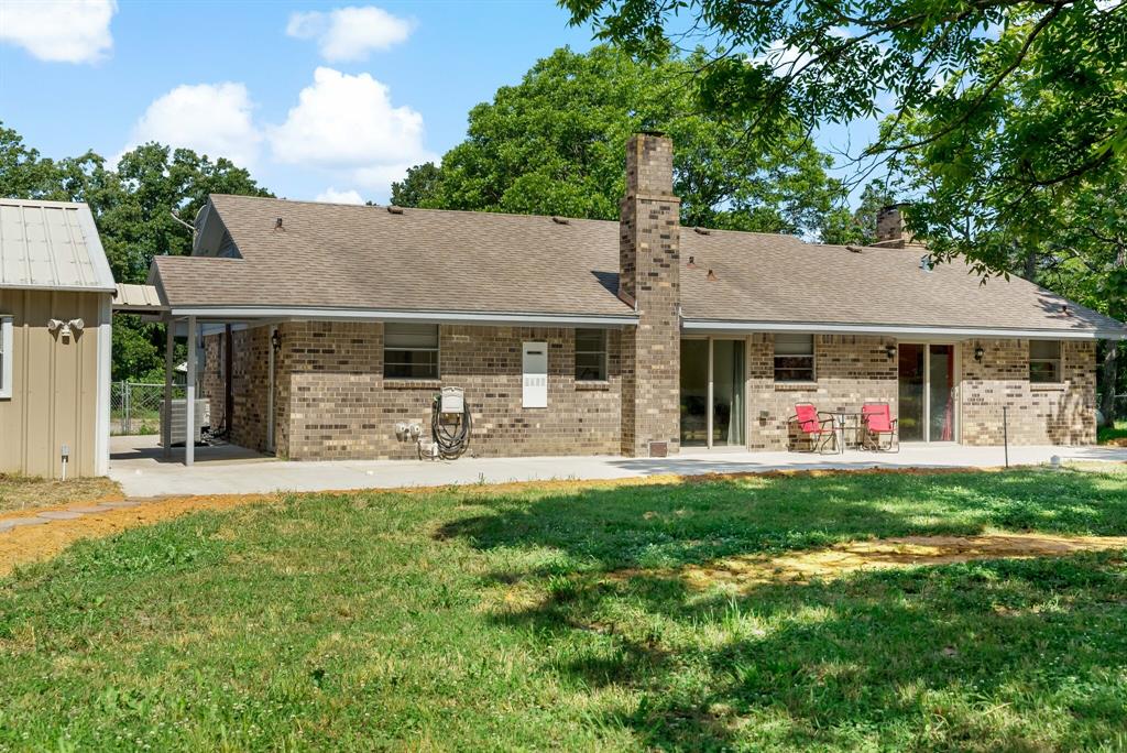 150 County Road Arthur City, TX 75411 - Photo 28 of 37 a front view of a residential houses with yard and green space