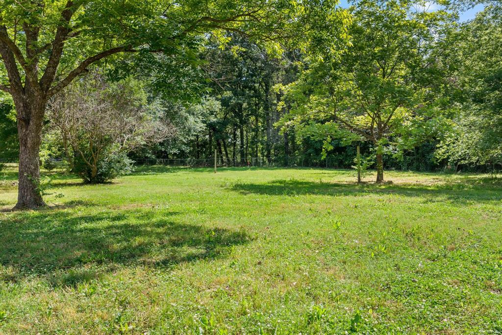 150 County Road Arthur City, TX 75411 - Photo 30 of 37 a view of green field with trees in the background