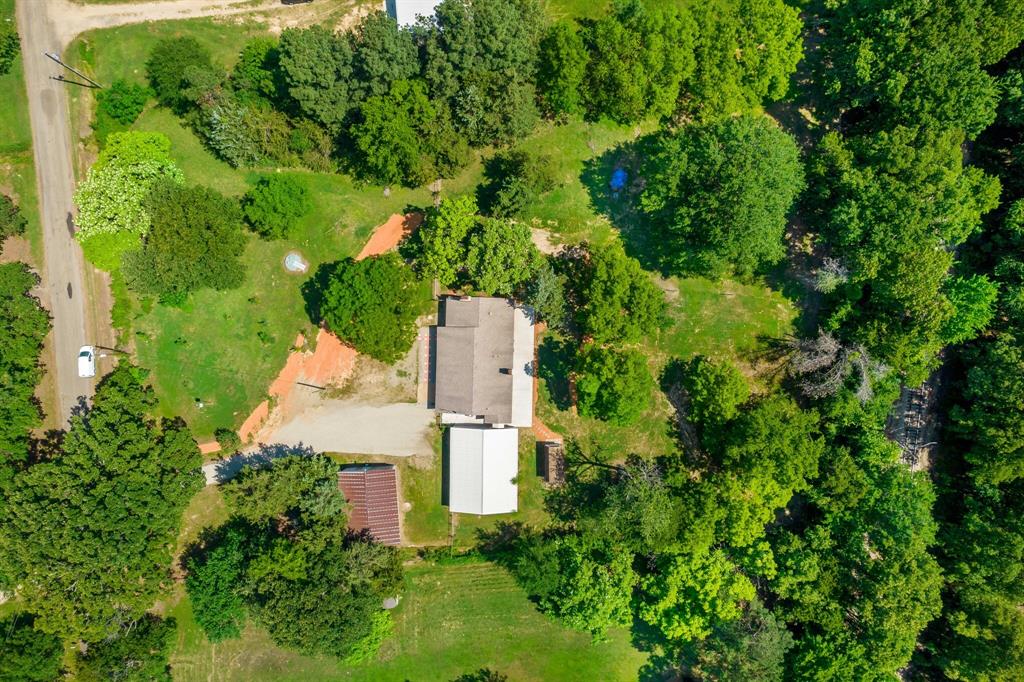 150 County Road Arthur City, TX 75411 - Photo 33 of 37 an aerial view of a house with a yard