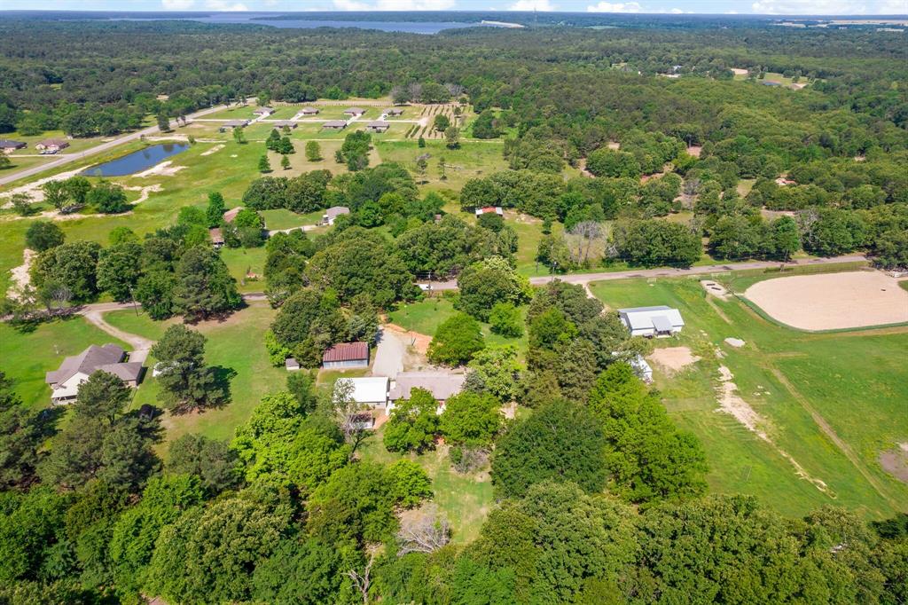 150 County Road Arthur City, TX 75411 - Photo 35 of 37 an aerial view of residential houses with outdoor space and trees
