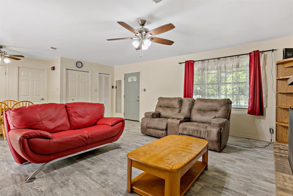 150 County Road Arthur City, TX 75411 - Photo 6 of 37 a living room with furniture and a window