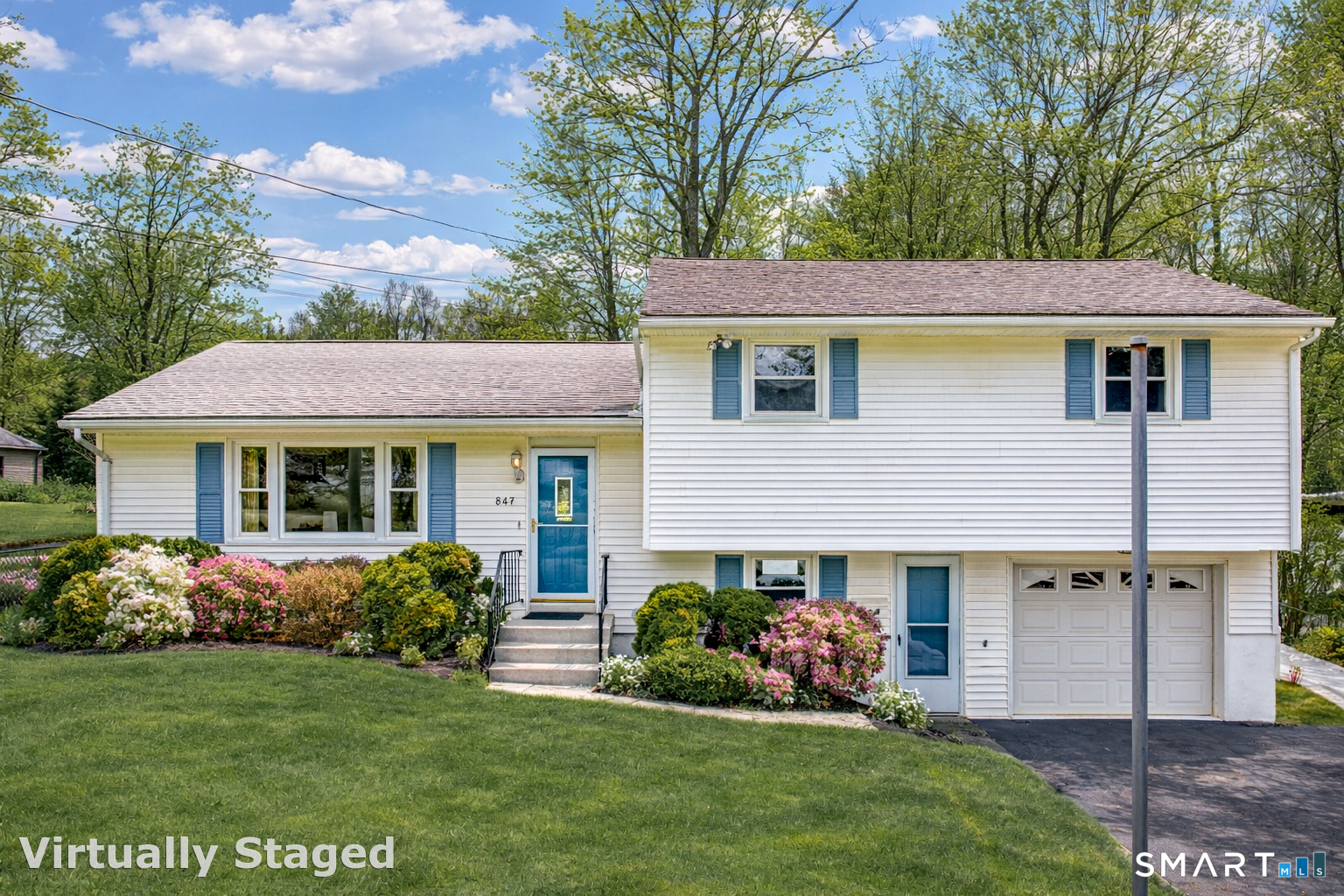 464 French Street Watertown, CT 06779 - Photo 1 of 30 a front view of a house with a garden and plants