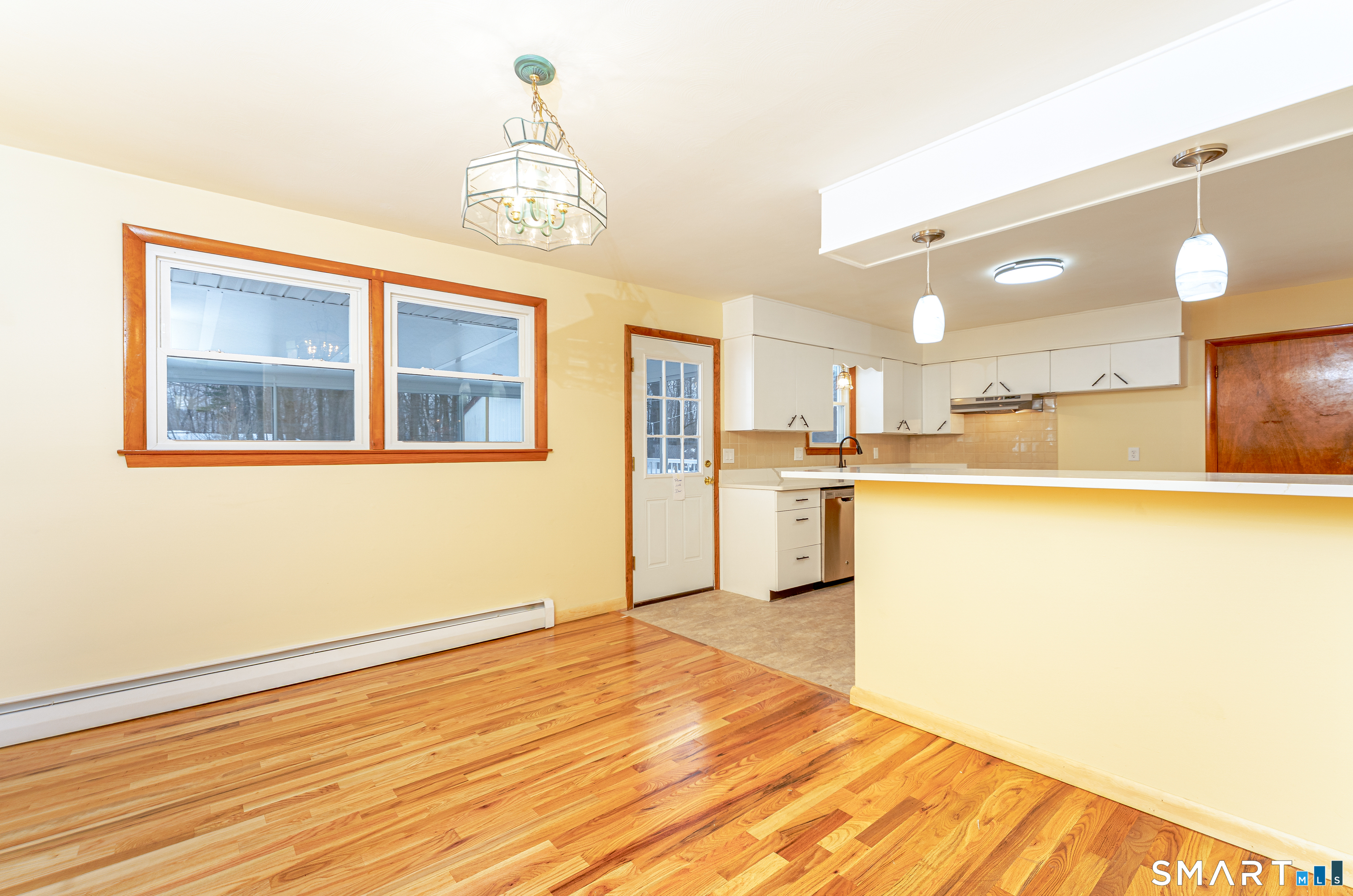 464 French Street Watertown, CT 06779 - Photo 13 of 30 a view of a kitchen with wooden floor and a kitchen