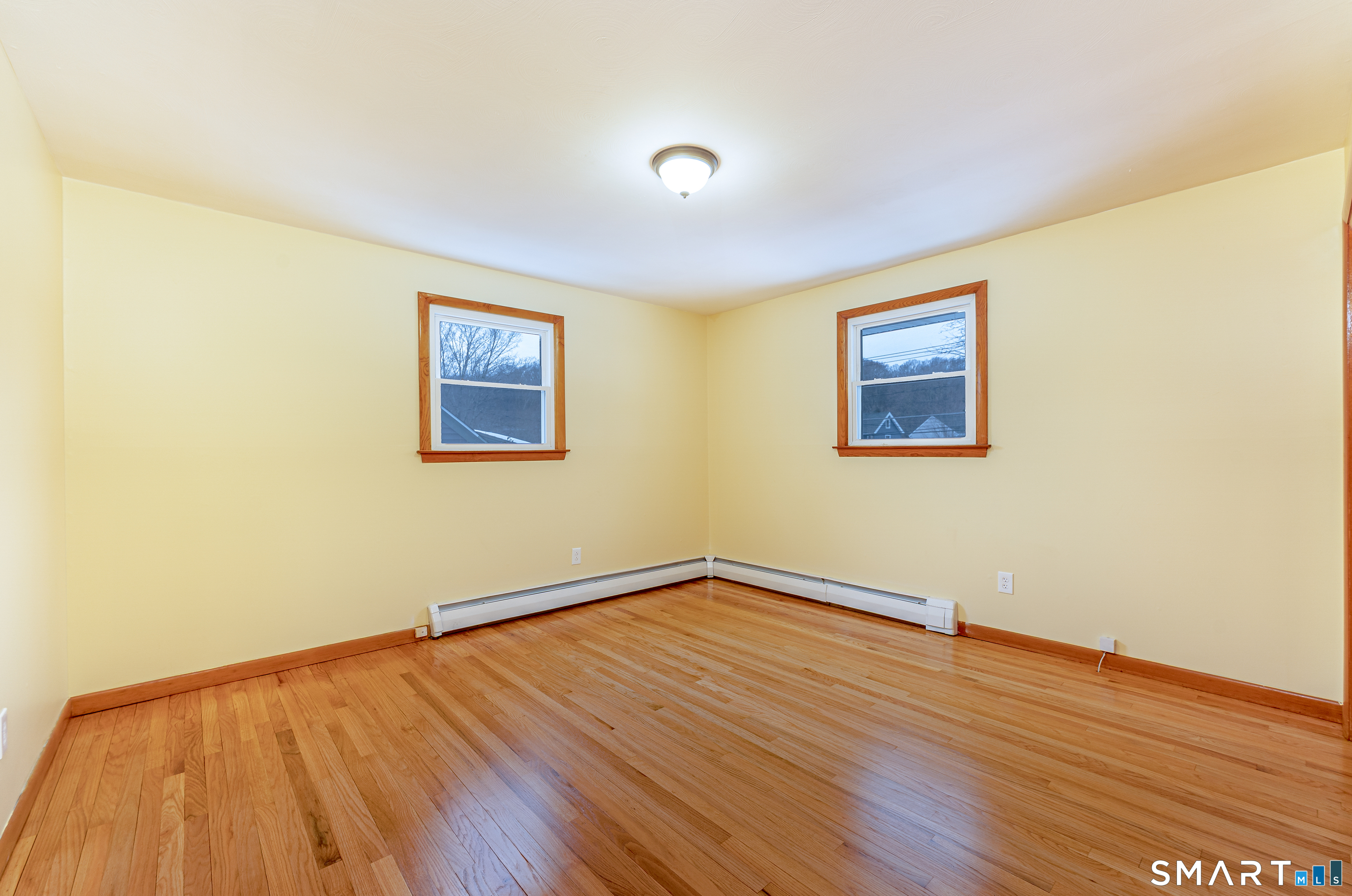 464 French Street Watertown, CT 06779 - Photo 19 of 30 a view of an empty room with wooden floor and a window