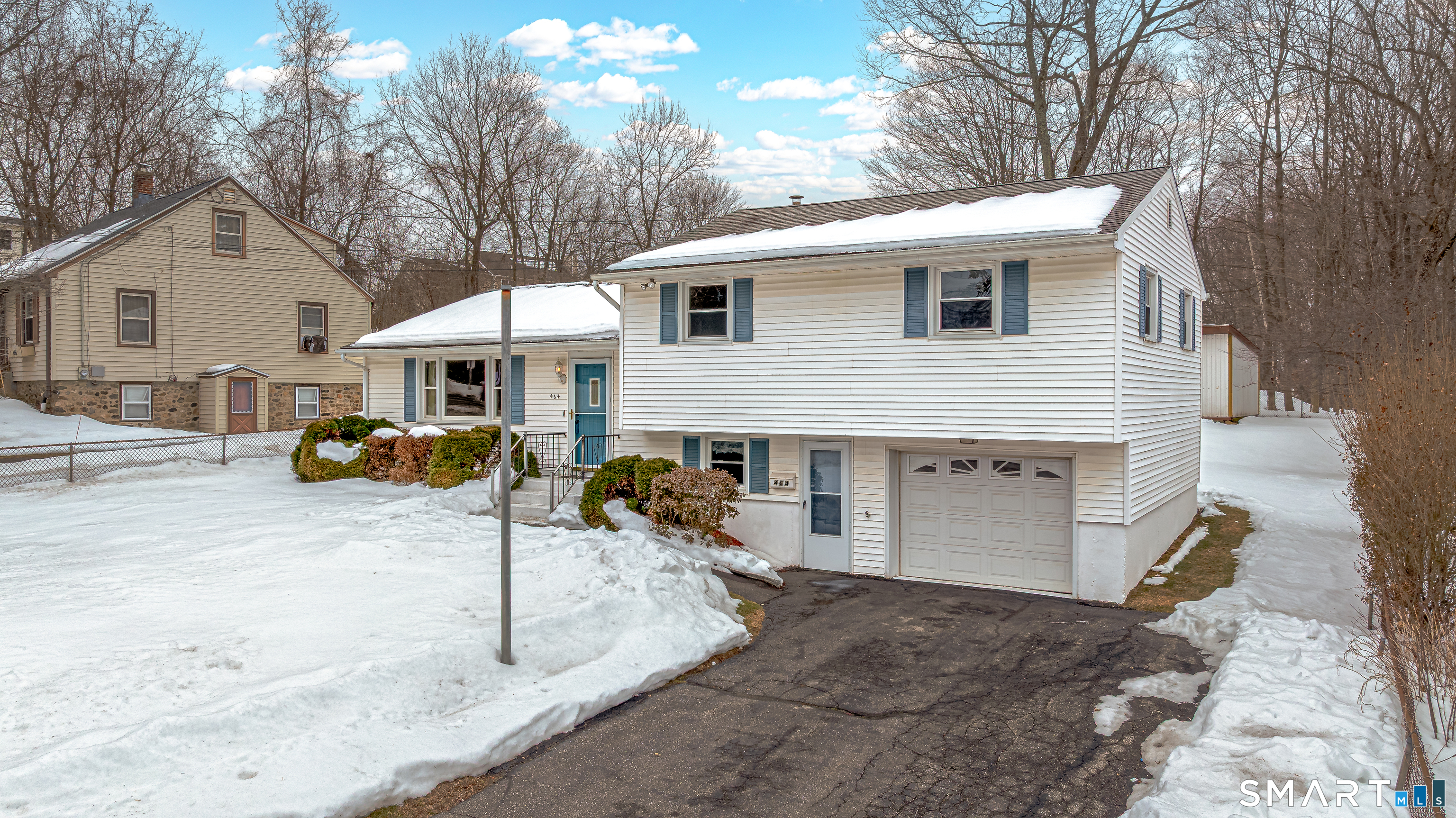 464 French Street Watertown, CT 06779 - Photo 2 of 30 a view of a white house with large windows next to a road
