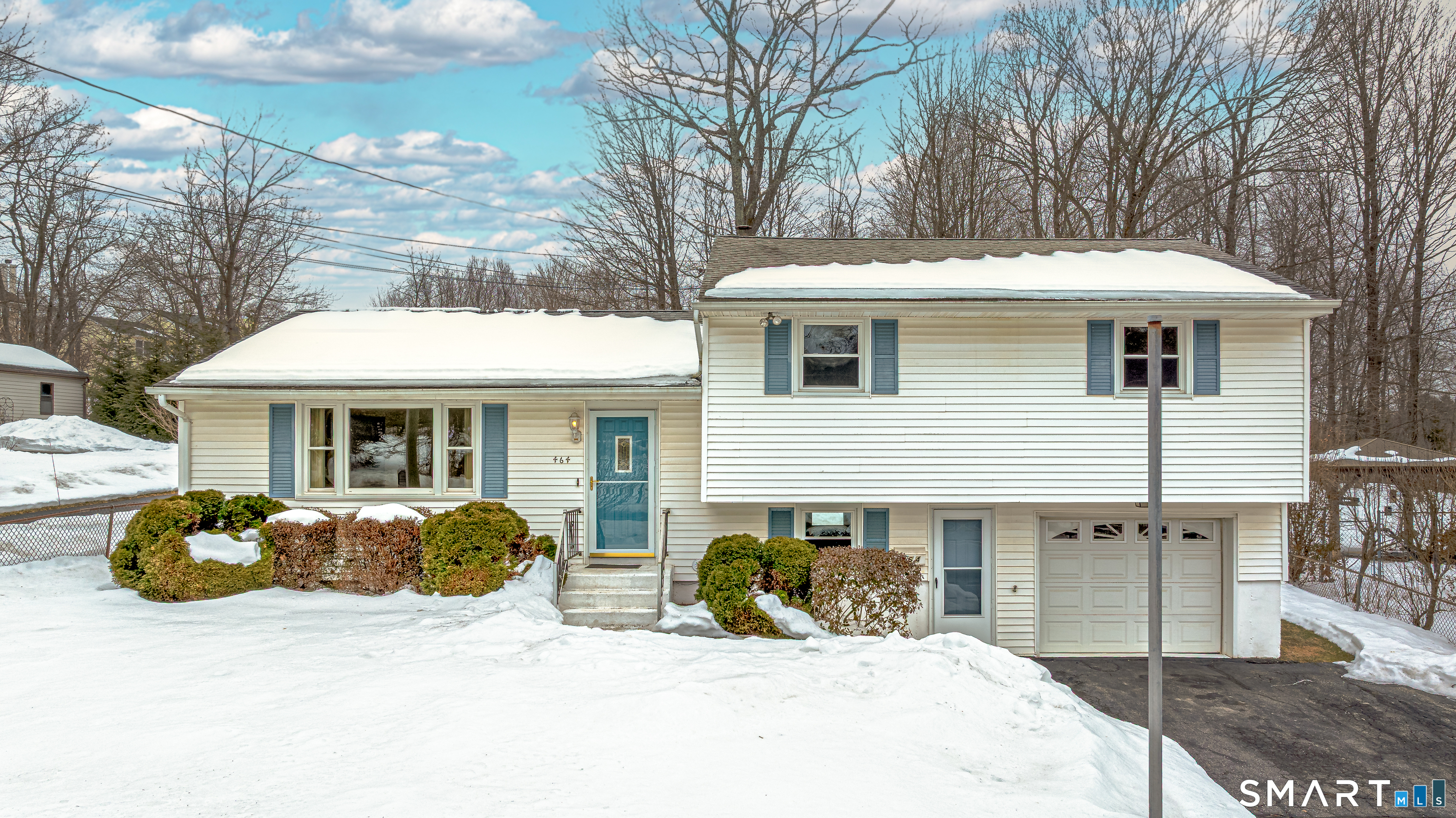464 French Street Watertown, CT 06779 - Photo 28 of 30 a front view of a house with yard outdoor seating and garage