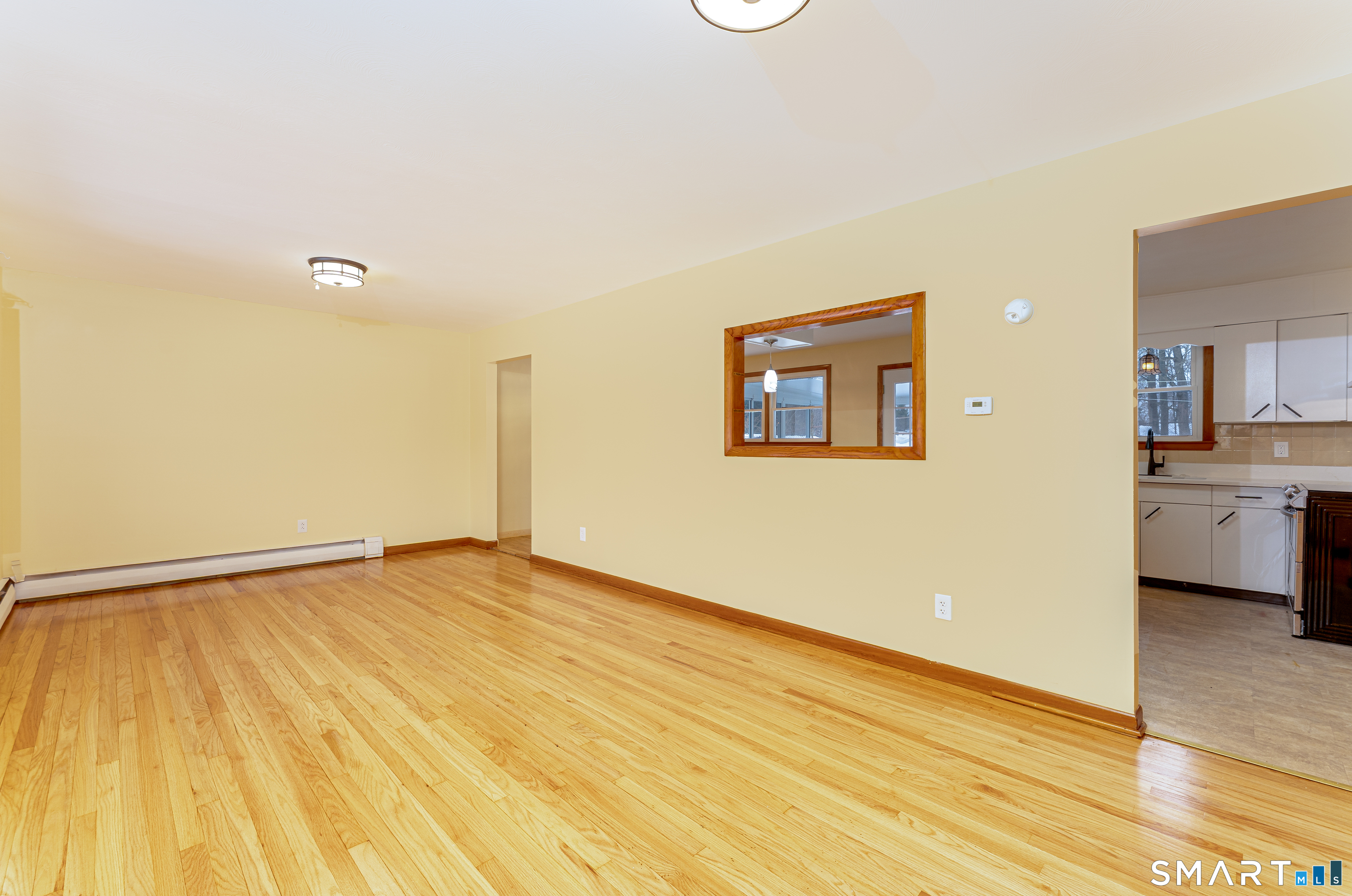464 French Street Watertown, CT 06779 - Photo 3 of 30 a view of an empty room with wooden floor and a window