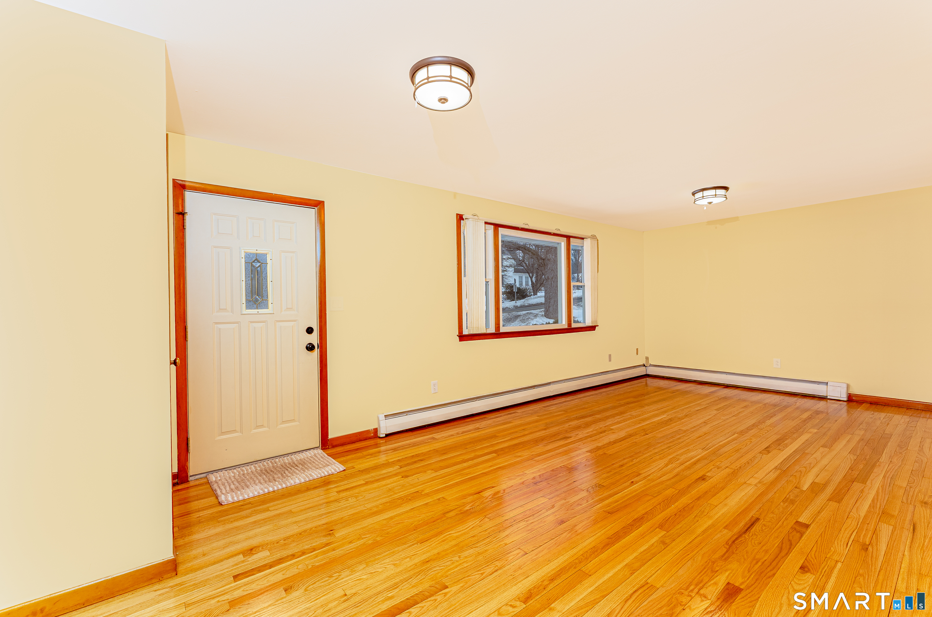 464 French Street Watertown, CT 06779 - Photo 5 of 30 a view of an empty room with wooden floor and a window