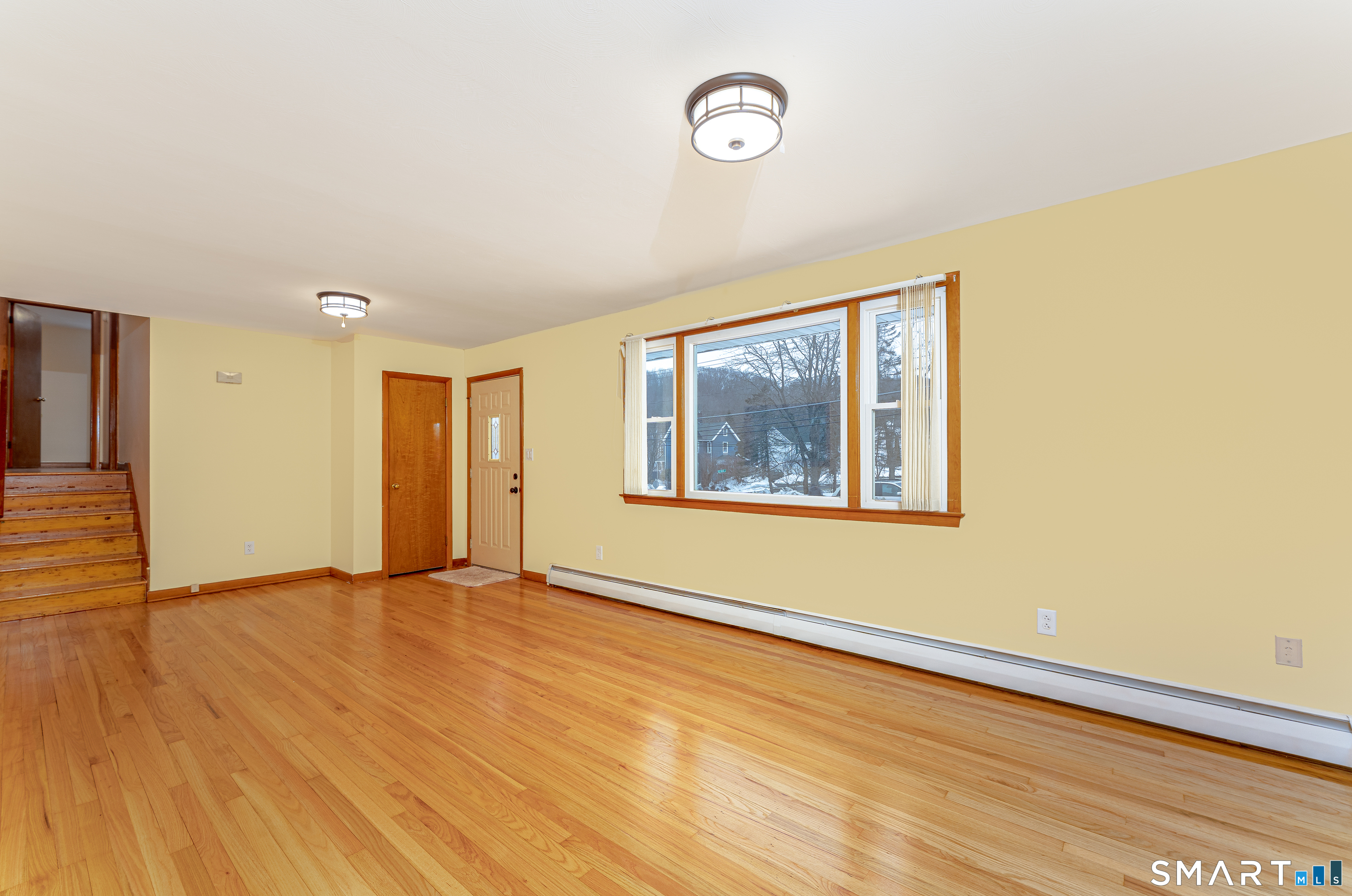 464 French Street Watertown, CT 06779 - Photo 6 of 30 a view of an empty room with wooden floor and a window