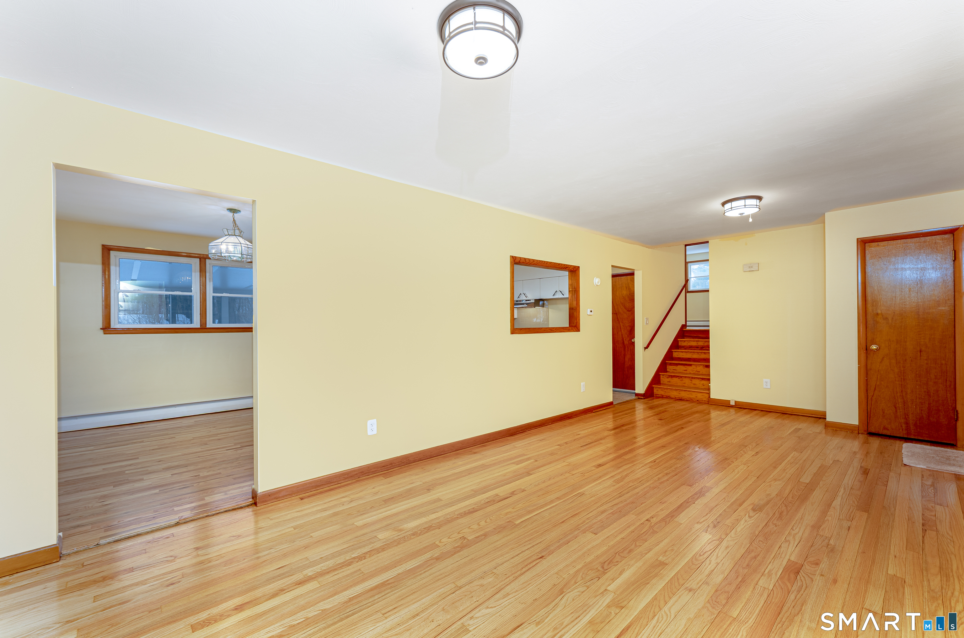 464 French Street Watertown, CT 06779 - Photo 7 of 30 a view of an empty room with wooden floor and a window