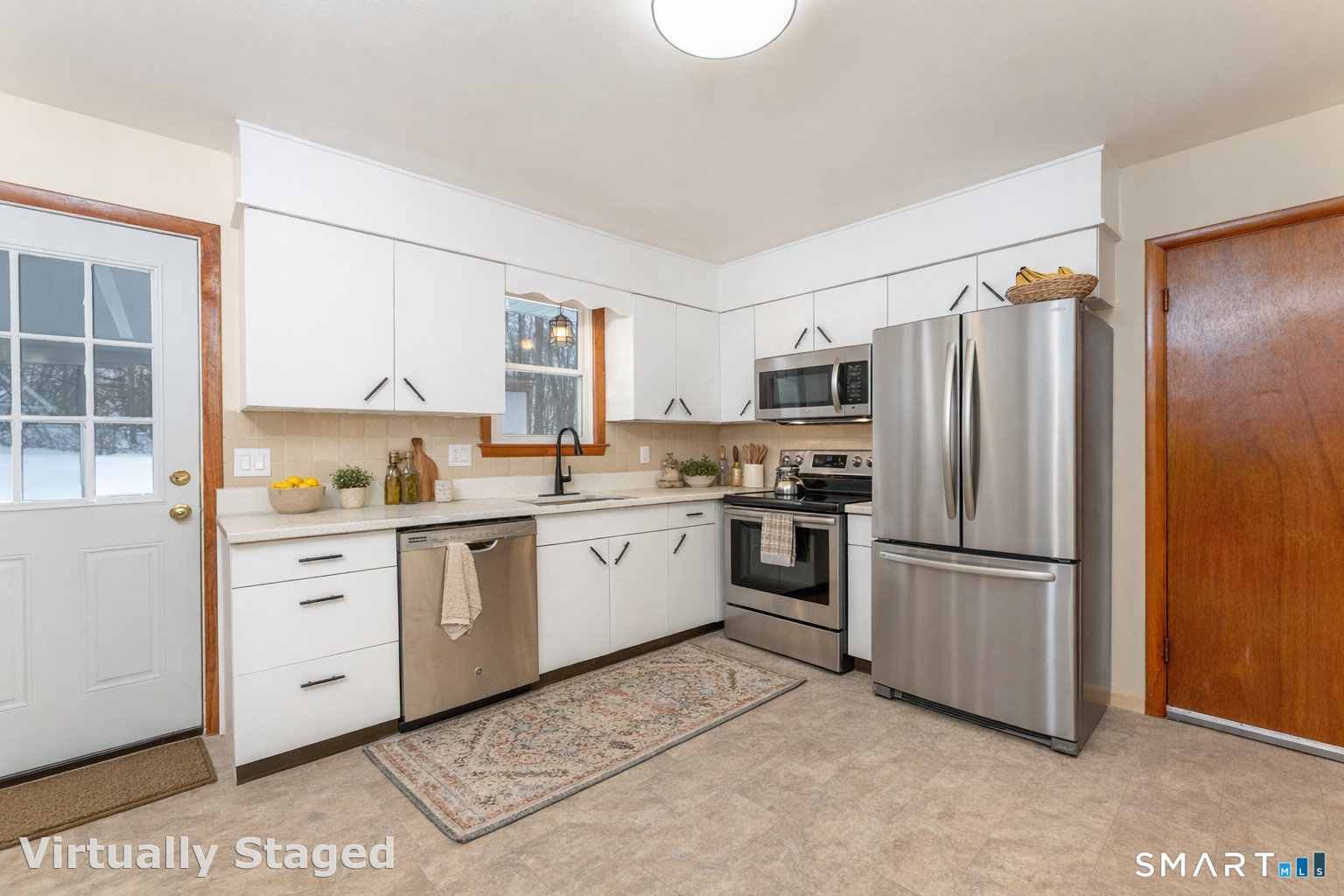 464 French Street Watertown, CT 06779 - Photo 9 of 30 a kitchen with white cabinets and stainless steel appliances