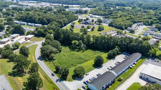 an aerial view of residential house with outdoor space and swimming pool