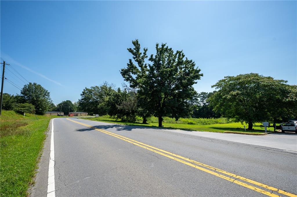 0 Mauldin Road Northwest Calhoun, GA 30701 - Photo 8 of 13 a view of road with grass and a trees