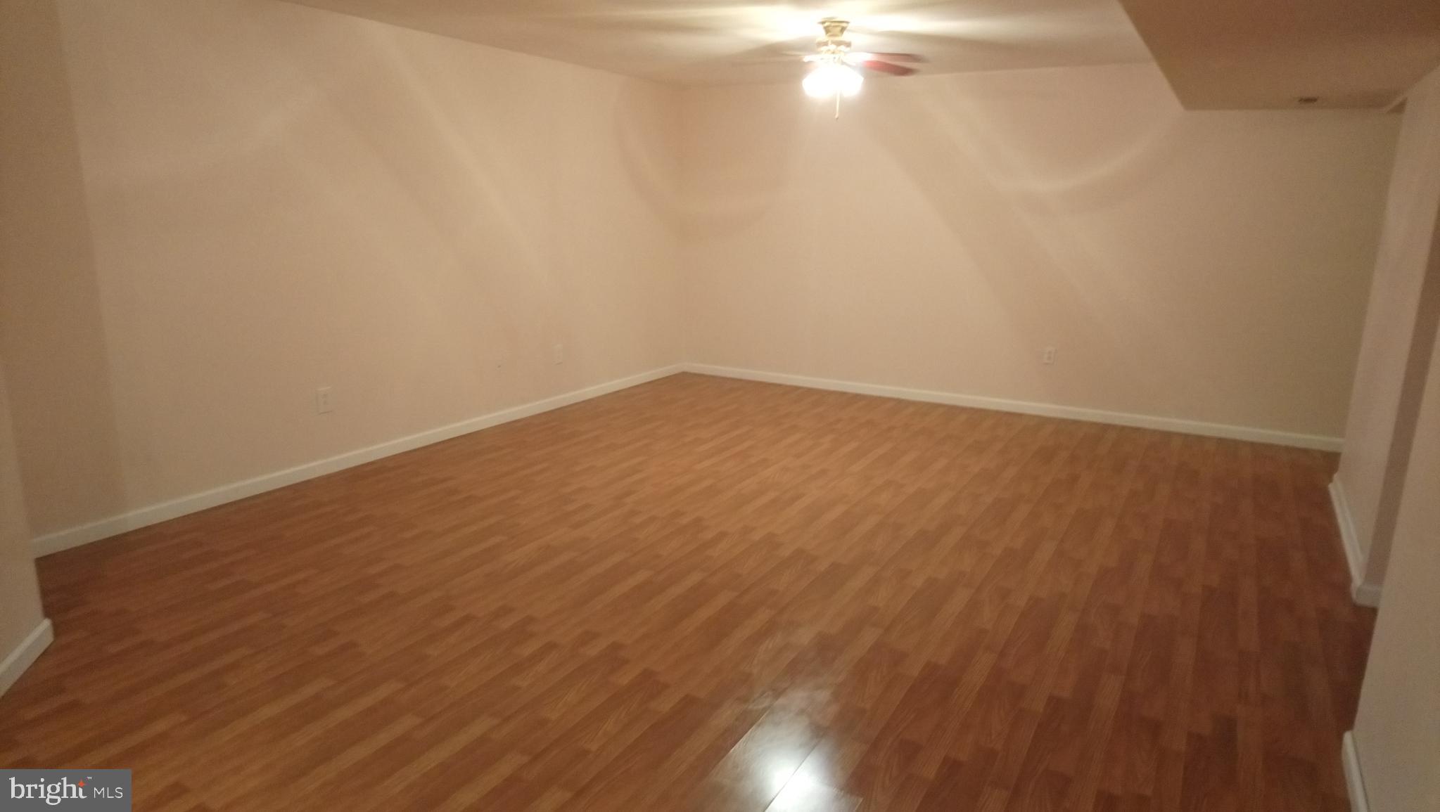 8795 Lowell Road Pomfret, MD 20675 - Photo 30 of 65 Lower level family/rec room