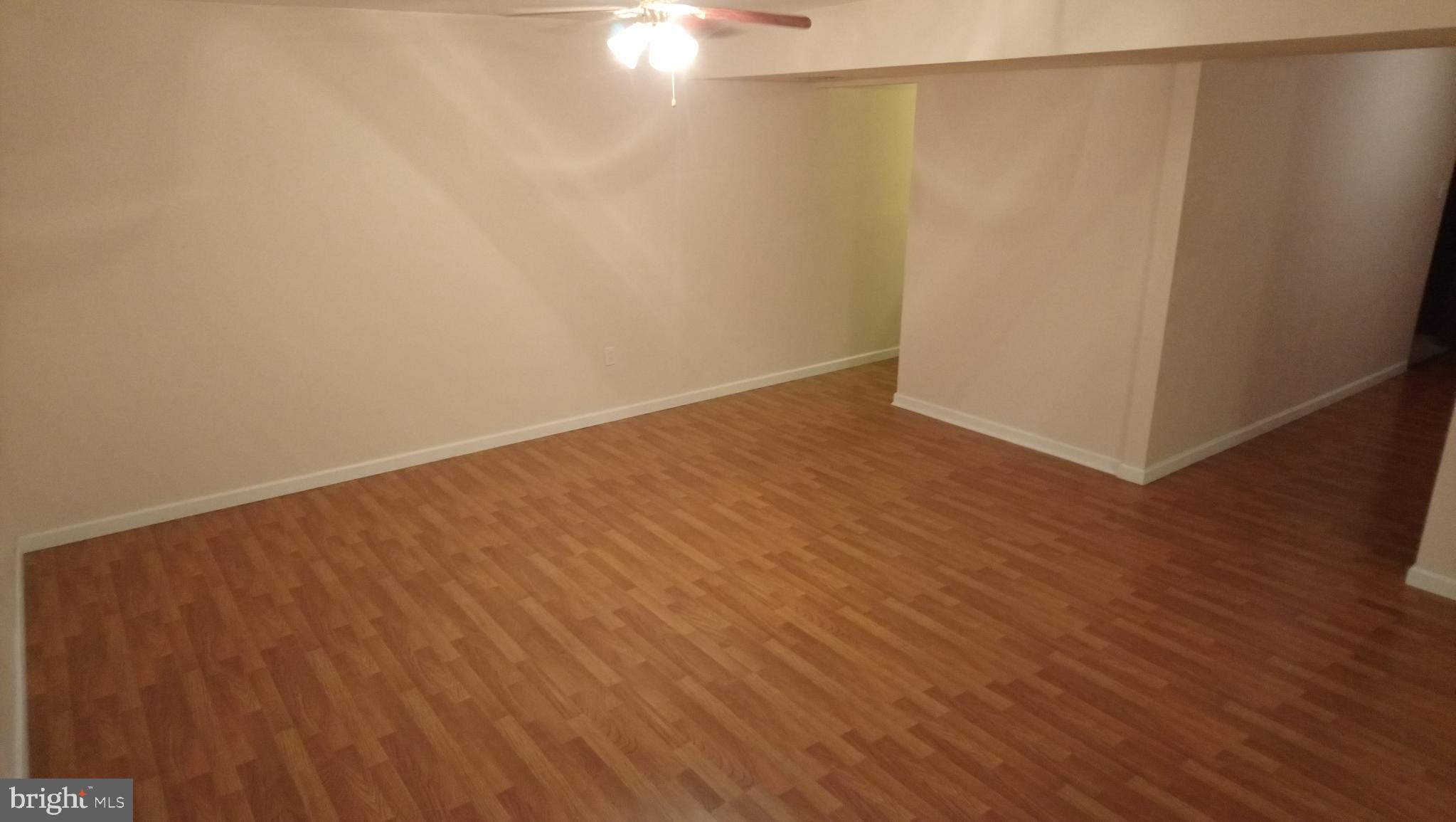 8795 Lowell Road Pomfret, MD 20675 - Photo 32 of 65 Lower level family/rec room