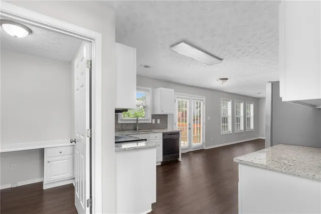 a bathroom with a sink toilet and a mirror