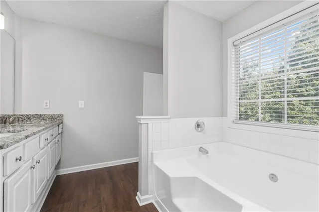a bathroom with a sink and mirror