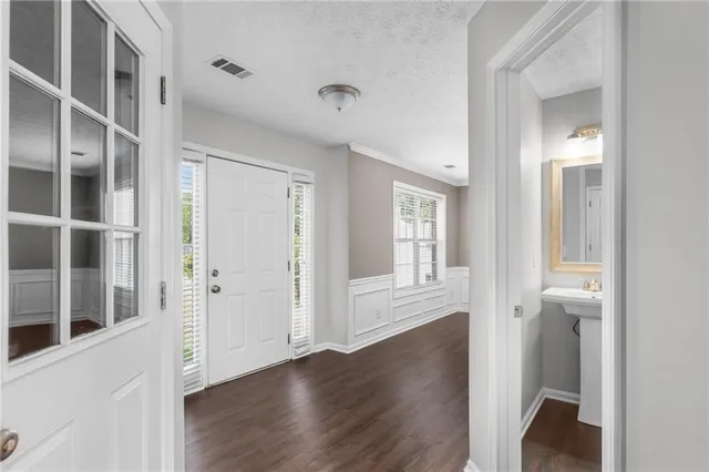 an empty room with wooden floor