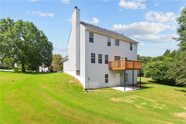 a view of a backyard with sitting area
