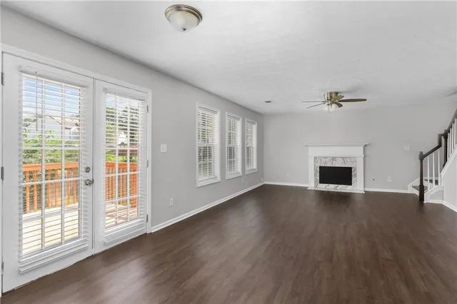a kitchen with cabinets stainless steel appliances and wooden floor