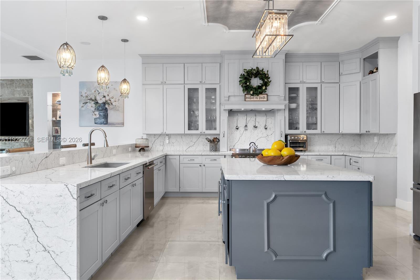 15701 Southwest 254th Street Homestead, FL 33031 - Photo 14 of 50 a kitchen with a sink a stove cabinets and counter space
