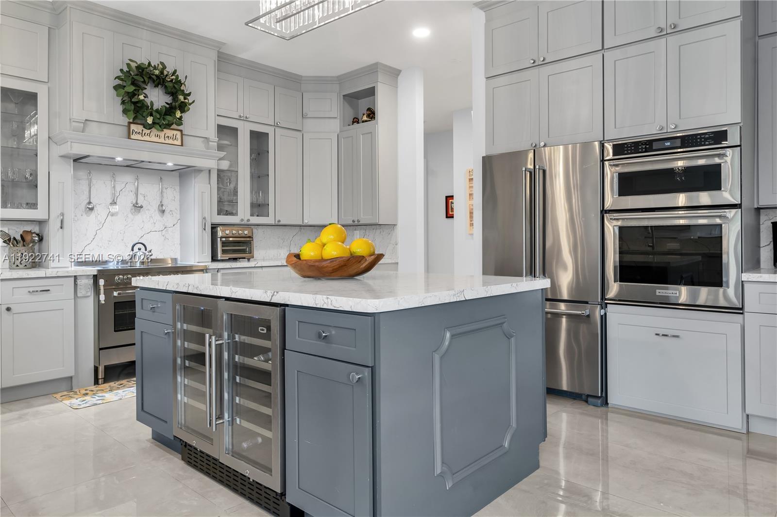 15701 Southwest 254th Street Homestead, FL 33031 - Photo 16 of 50 a kitchen with stainless steel appliances a stove a sink and a refrigerator