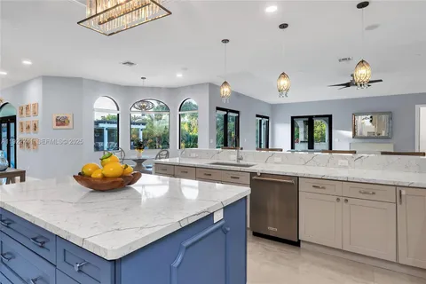 a kitchen with cabinets and window