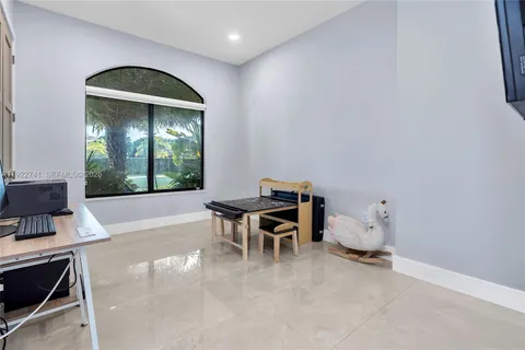 a workspace with furniture and window