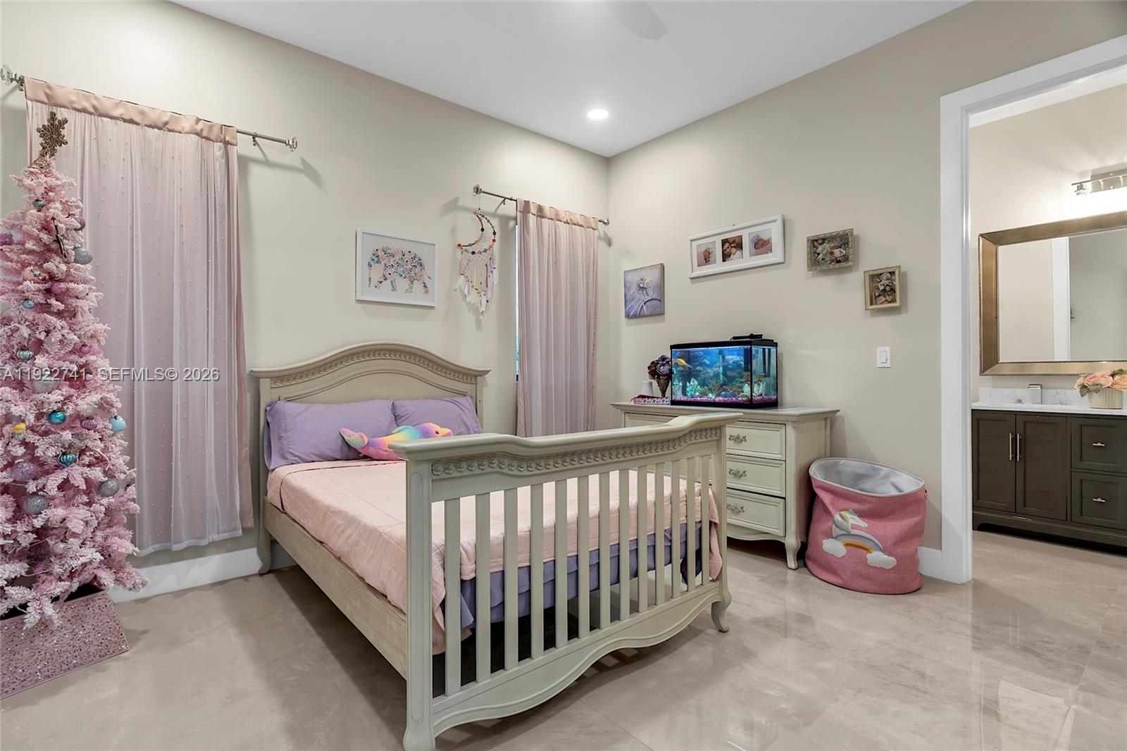 15701 Southwest 254th Street Homestead, FL 33031 - Photo 29 of 50 a bedroom with a bed and a window