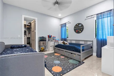 a living room with furniture and a clock