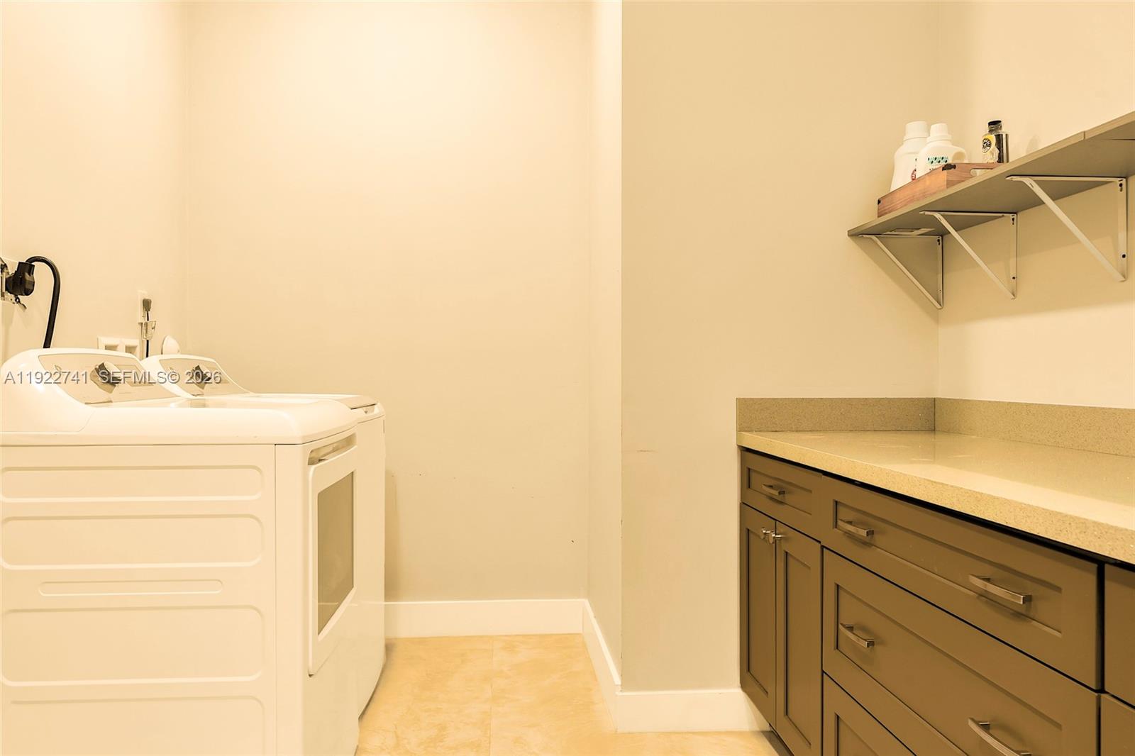 15701 Southwest 254th Street Homestead, FL 33031 - Photo 36 of 50 a bathroom with a sink and a mirror