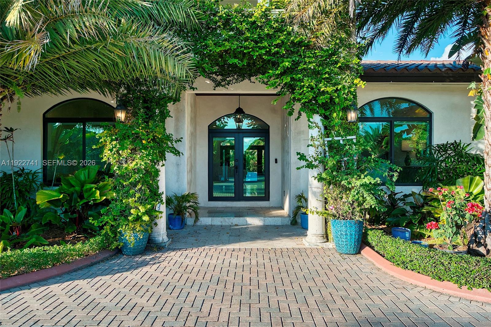 15701 Southwest 254th Street Homestead, FL 33031 - Photo 4 of 50 a front view of a house with a porch