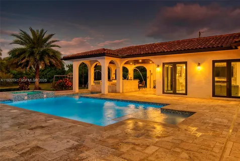 a view of swimming pool with outdoor seating