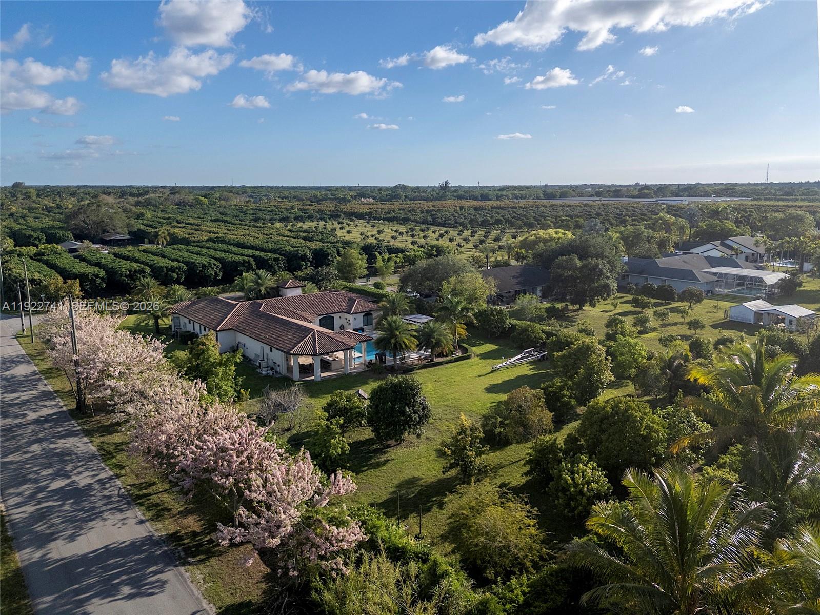 15701 Southwest 254th Street Homestead, FL 33031 - Photo 51 of 52 an aerial view of residential building and lake