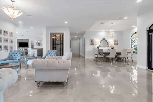 a living room with fireplace furniture and a flat screen tv