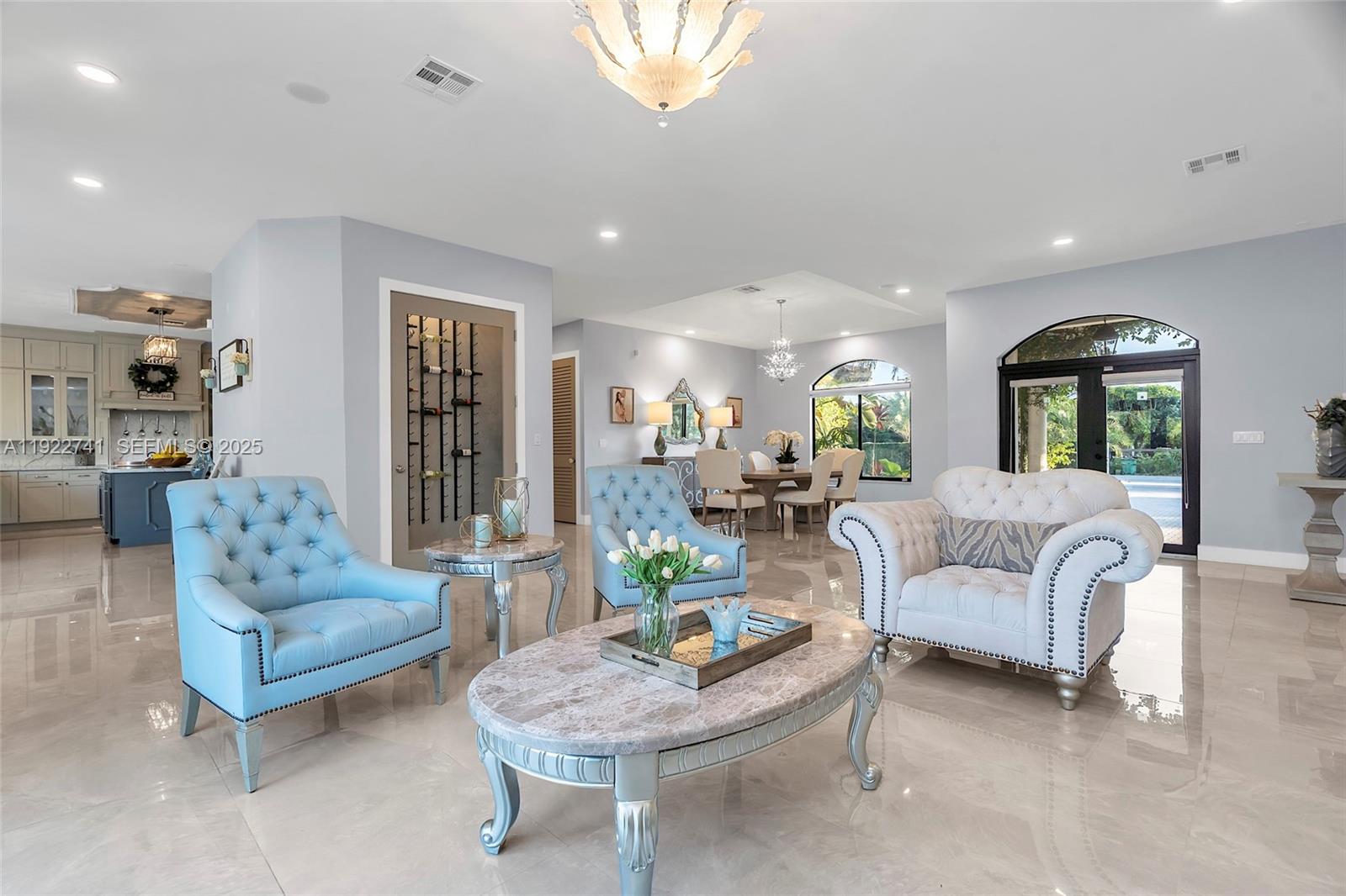 15701 Southwest 254th Street Homestead, FL 33031 - Photo 9 of 50 a living room with furniture and a view of kitchen