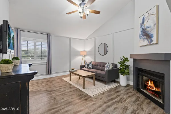 a living room with furniture and a fireplace