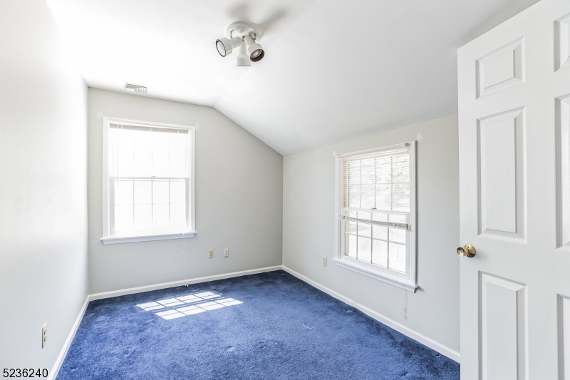 13 Wayne Boulevard Madison, NJ 07940 - Photo 11 of 19 a view of an empty room with a window
