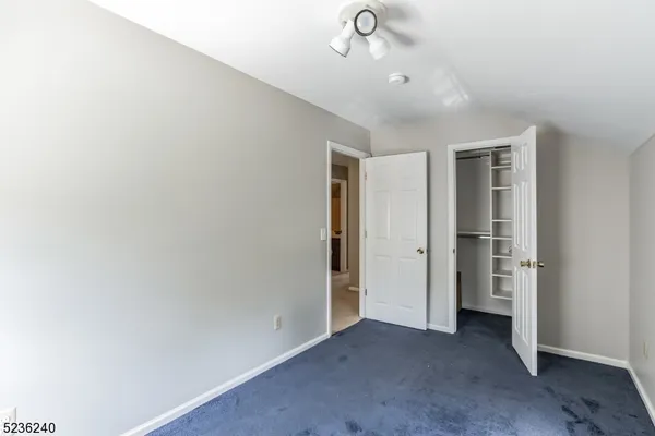 an empty room with a empty space and windows