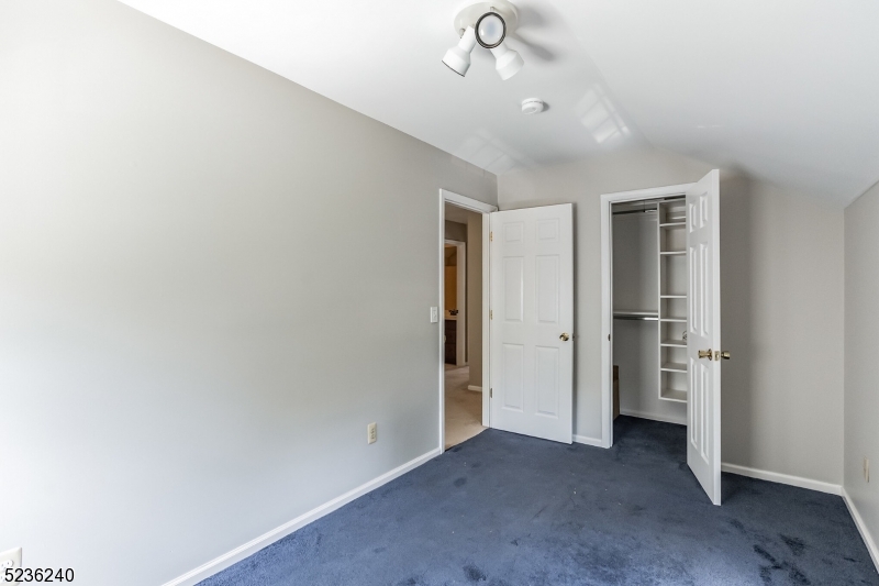 13 Wayne Boulevard Madison, NJ 07940 - Photo 12 of 19 an empty room with a empty space and windows