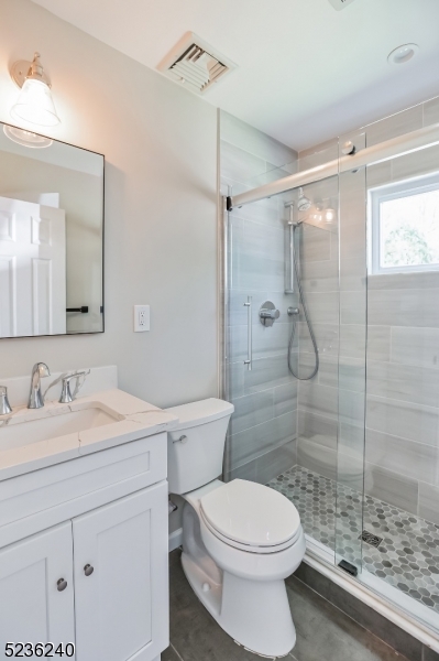 13 Wayne Boulevard Madison, NJ 07940 - Photo 14 of 19 a bathroom with a toilet sink vanity granite and shower