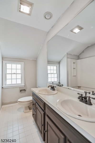 13 Wayne Boulevard Madison, NJ 07940 - Photo 15 of 19 a bathroom with a sink double vanity granite and a toilet