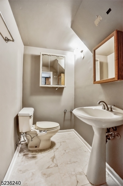 13 Wayne Boulevard Madison, NJ 07940 - Photo 16 of 19 a bathroom with a sink toilet and mirror